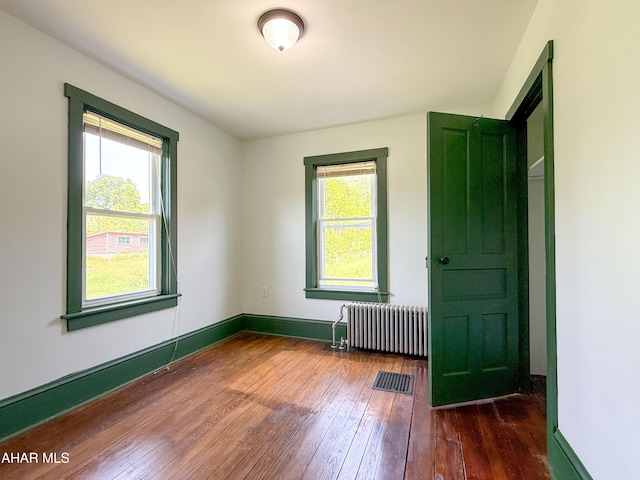 346 Lower Snake Spring Rd, Everett, PA 15537 - unfurnished bedroom with radiator heating unit and hardwood / wood-style floors