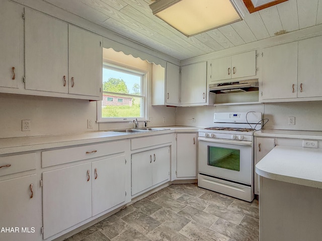 346 Lower Snake Spring Rd, Everett, PA 15537 - kitchen with white gas range, under cabinet range hood, wood ceiling, light countertops, and stone finish flooring