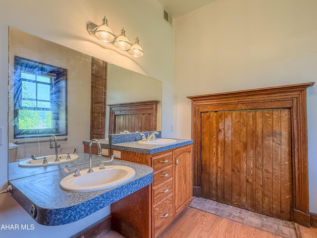 346 Lower Snake Spring Rd, Everett, PA 15537 - bathroom with wood finished floors, vanity, and a bathtub