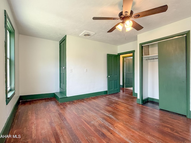 346 Lower Snake Spring Rd, Everett, PA 15537 - unfurnished bedroom with hardwood / wood-style flooring, a closet, a ceiling fan, and multiple windows
