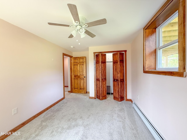 346 Lower Snake Spring Rd, Everett, PA 15537 - unfurnished bedroom featuring a baseboard heating unit, light carpet, a closet, and a ceiling fan