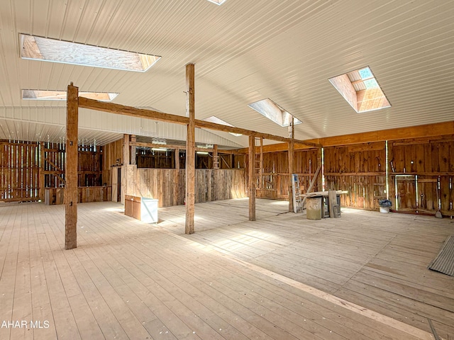 346 Lower Snake Spring Rd, Everett, PA 15537 - misc room featuring a skylight, vaulted ceiling, and hardwood / wood-style flooring