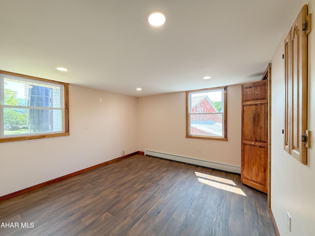 346 Lower Snake Spring Rd, Everett, PA 15537 - spare room featuring a baseboard heating unit, dark wood finished floors, healthy amount of natural light, and recessed lighting