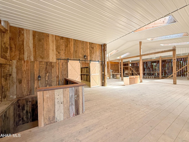 346 Lower Snake Spring Rd, Everett, PA 15537 - misc room featuring wood walls, vaulted ceiling, and wood-type flooring