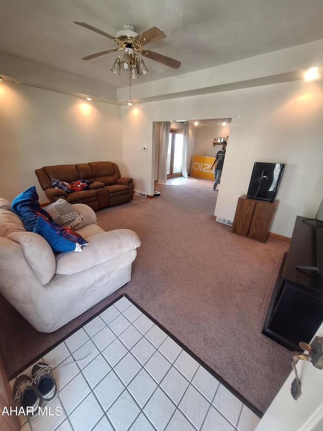 carpeted living room with ceiling fan