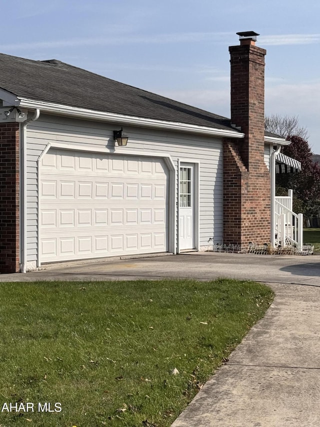 garage featuring a yard