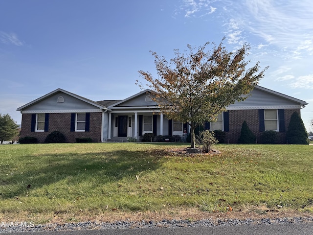 single story home with covered porch and a front lawn