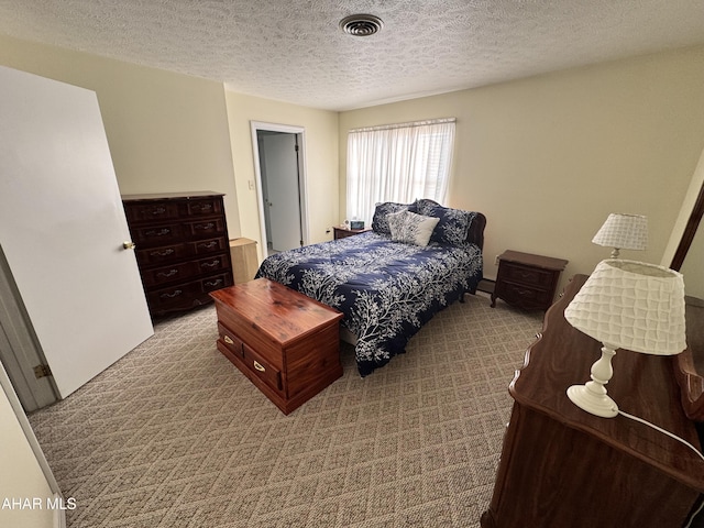 carpeted bedroom with a textured ceiling