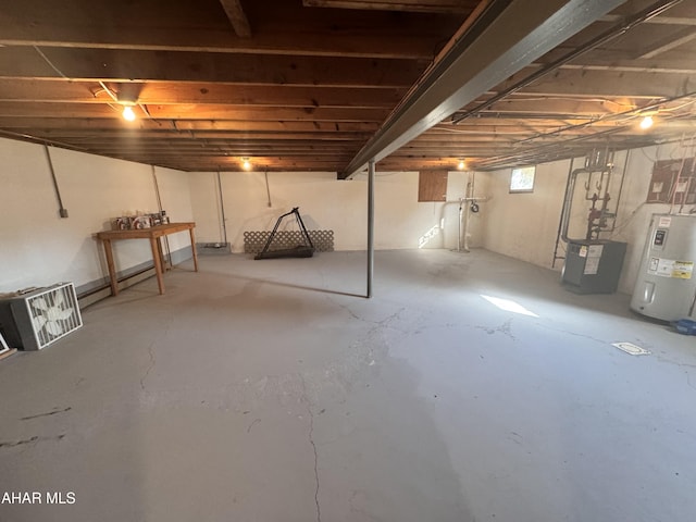 basement featuring electric water heater and a baseboard heating unit