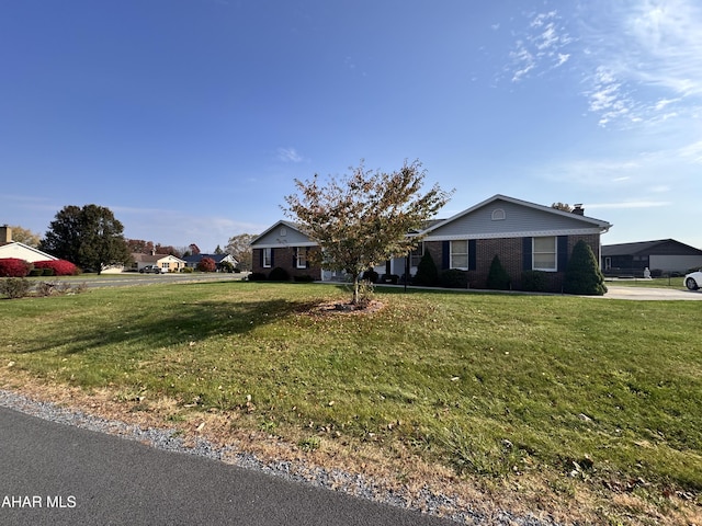 ranch-style house with a front lawn