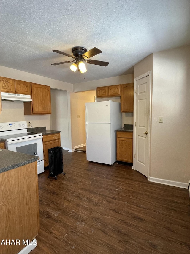 kitchen featuring dark hardwood / wood-style flooring, white appliances, a textured ceiling, and ceiling fan