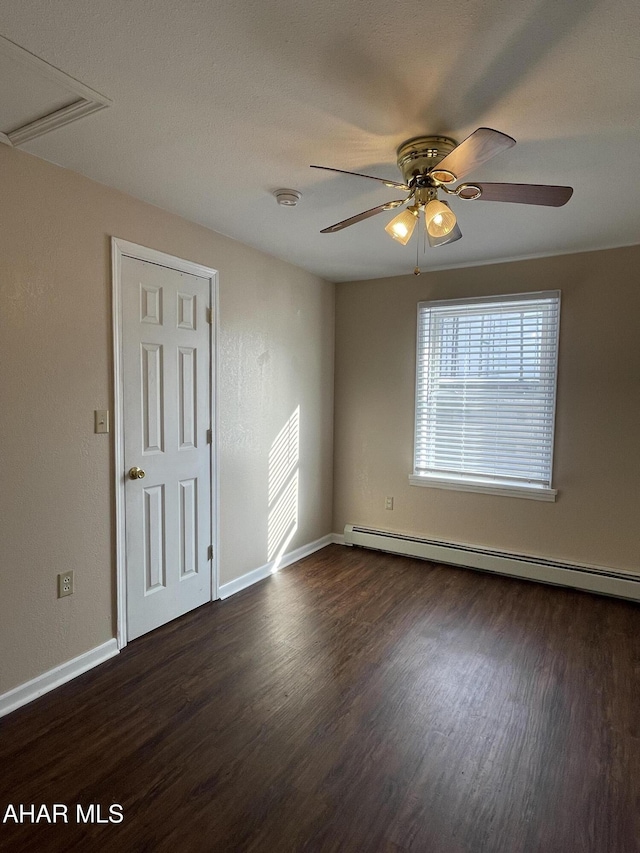 unfurnished room featuring ceiling fan, dark wood-type flooring, and a baseboard radiator