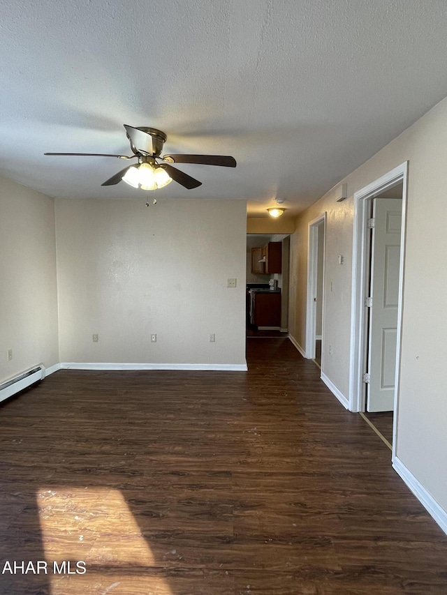 unfurnished room with ceiling fan, dark hardwood / wood-style flooring, and a textured ceiling