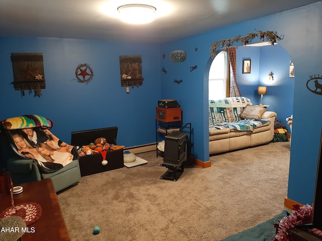 recreation room featuring carpet floors and baseboard heating