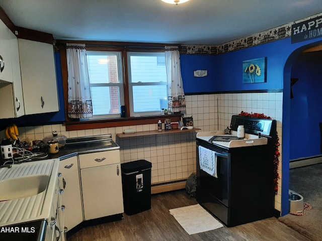 kitchen featuring white cabinetry, black electric range oven, tile walls, and dark hardwood / wood-style floors