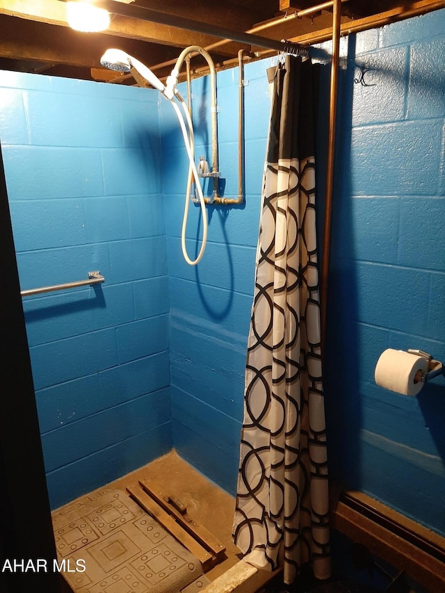 bathroom with a shower with shower curtain