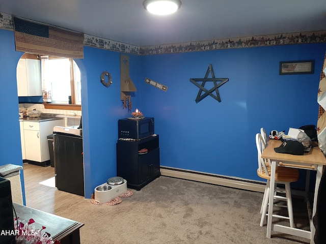 interior space with a baseboard radiator and light wood-type flooring