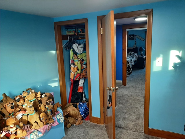 bedroom with carpet floors and a closet