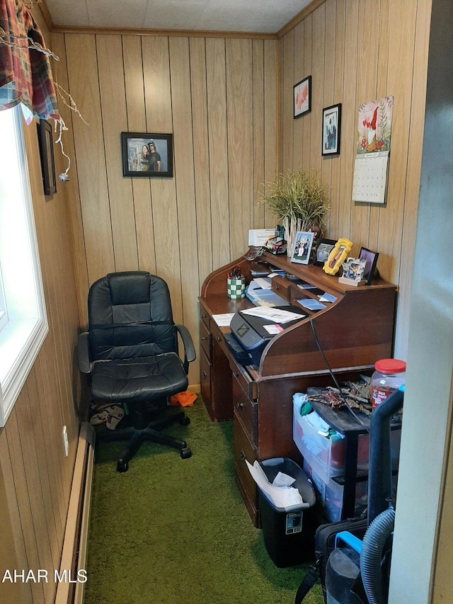 office area with a baseboard heating unit, carpet floors, and wooden walls