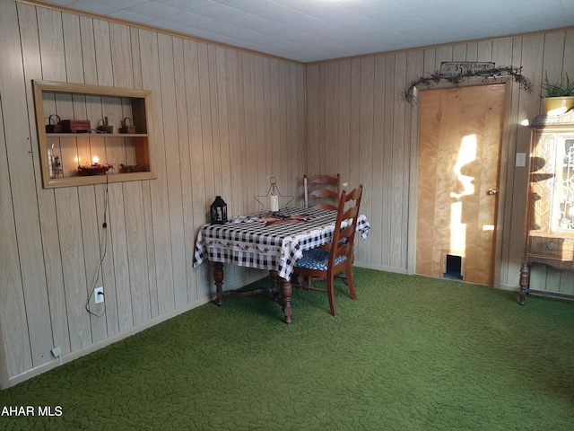 unfurnished dining area featuring carpet flooring