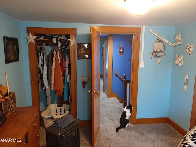 carpeted bedroom featuring a closet