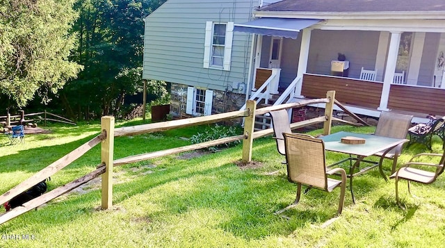 view of jungle gym featuring a lawn and fence