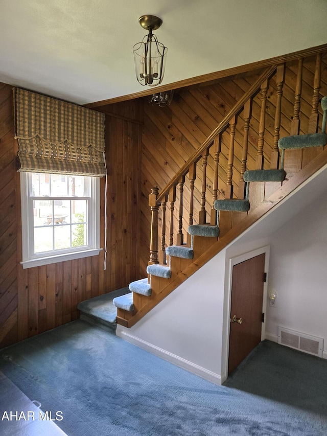 3576 Juniata Gap Rd, Altoona, PA 16601 - staircase with wood walls and carpet