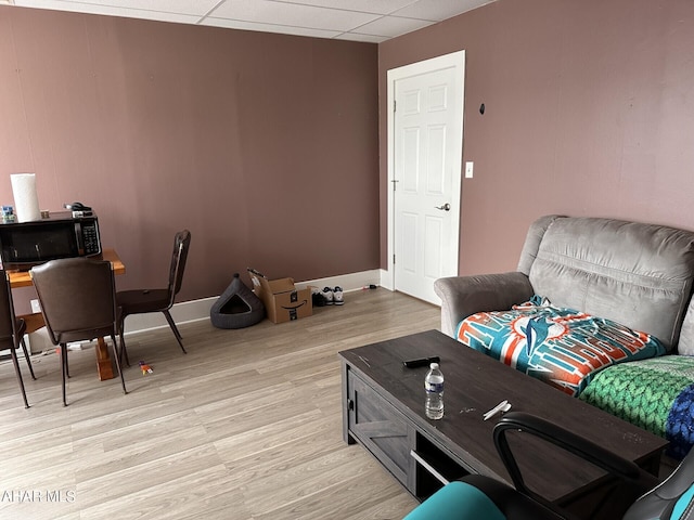 321 Main St, Gallitzin, PA 16641 - living area with baseboards, a drop ceiling, and light wood-style flooring