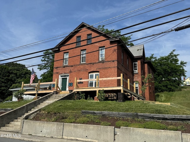 321 Main St, Gallitzin, PA 16641 - back of house with a yard, stairs, and brick siding