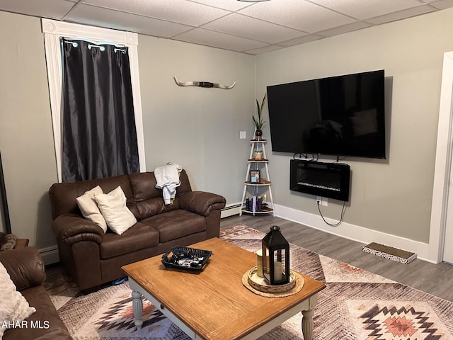 321 Main St, Gallitzin, PA 16641 - living room with a drop ceiling, a baseboard radiator, baseboards, and wood finished floors