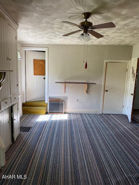 3091 Colonial Dr, Duncansville, PA 16635 - unfurnished living room with a ceiling fan, carpet, and baseboards