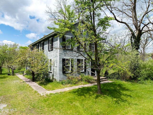 3091 Colonial Dr, Duncansville, PA 16635 - view of home's exterior featuring a lawn and a chimney