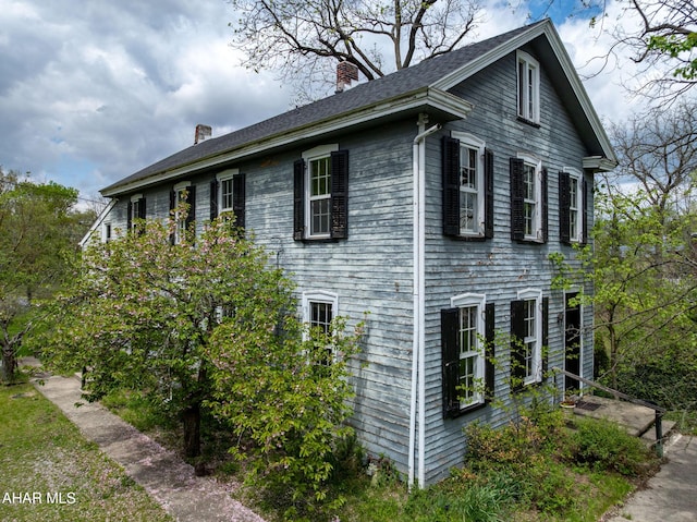 3091 Colonial Dr, Duncansville, PA 16635 - view of home's exterior with a chimney