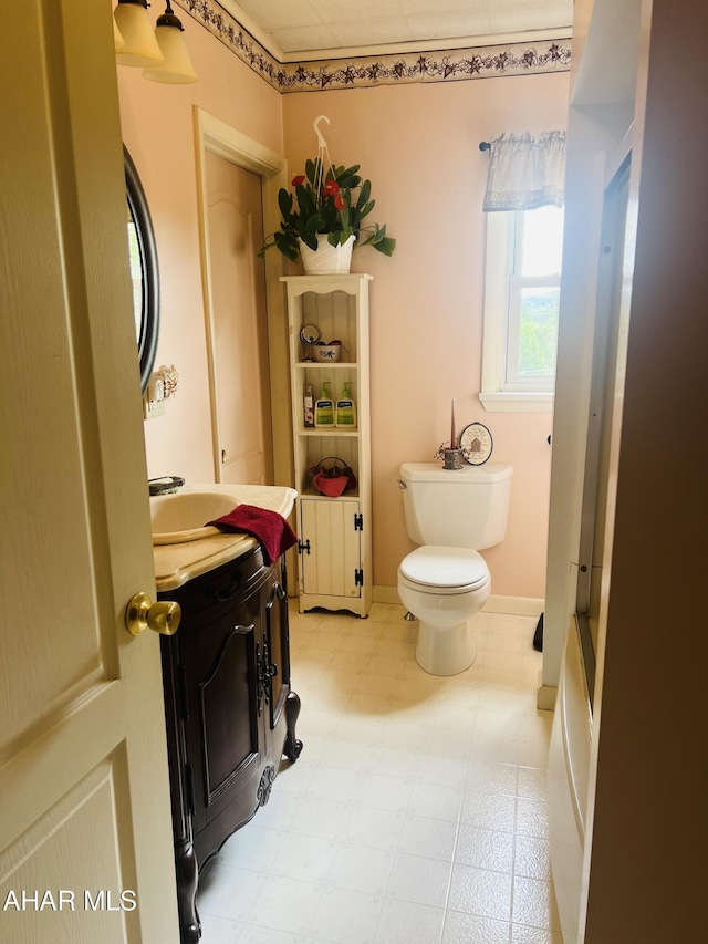 bathroom with vanity and toilet