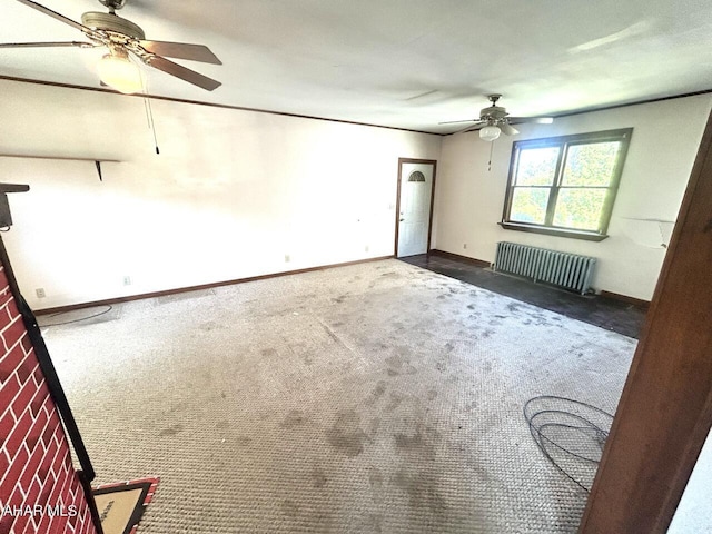 unfurnished room with dark carpet and radiator