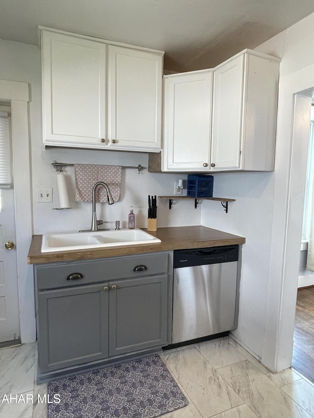 523 W 16th St, Tyrone, PA 16686 - kitchen featuring dishwasher, gray cabinets, light marble finish floors, and white cabinetry