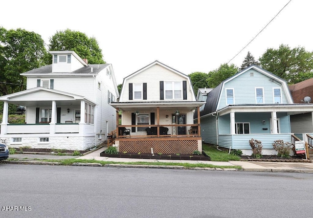 1809 5th St, Altoona, PA 16601 - colonial inspired home featuring a porch and a gambrel roof