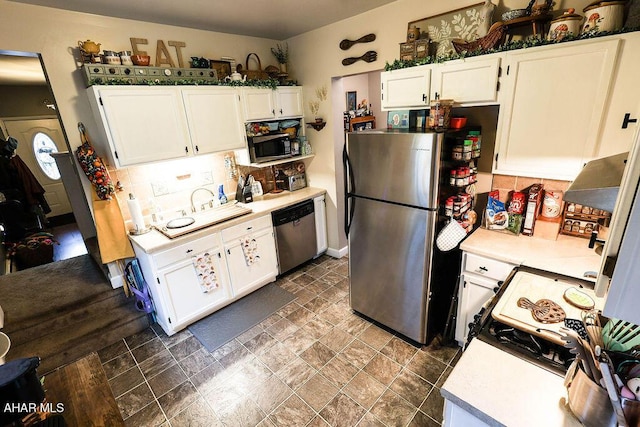 1809 5th St, Altoona, PA 16601 - kitchen featuring stainless steel appliances, light countertops, white cabinets, and tasteful backsplash