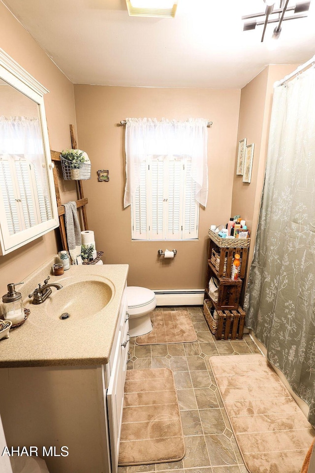1809 5th St, Altoona, PA 16601 - full bathroom featuring a baseboard heating unit, vanity, toilet, baseboards, and a shower with curtain