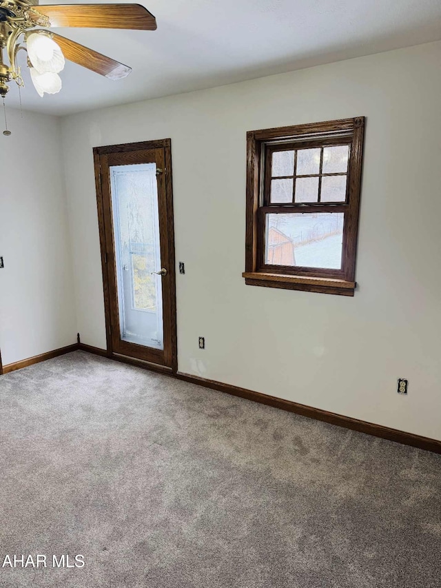 unfurnished room featuring carpet floors and ceiling fan