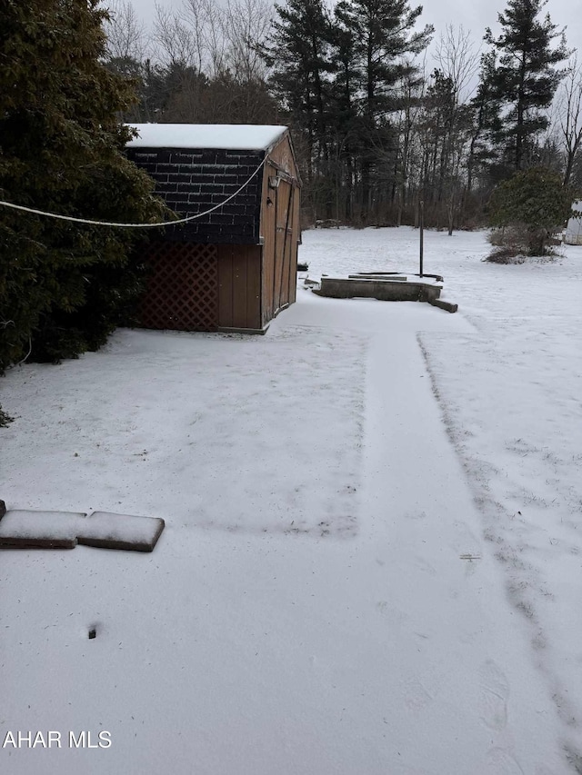 view of yard covered in snow