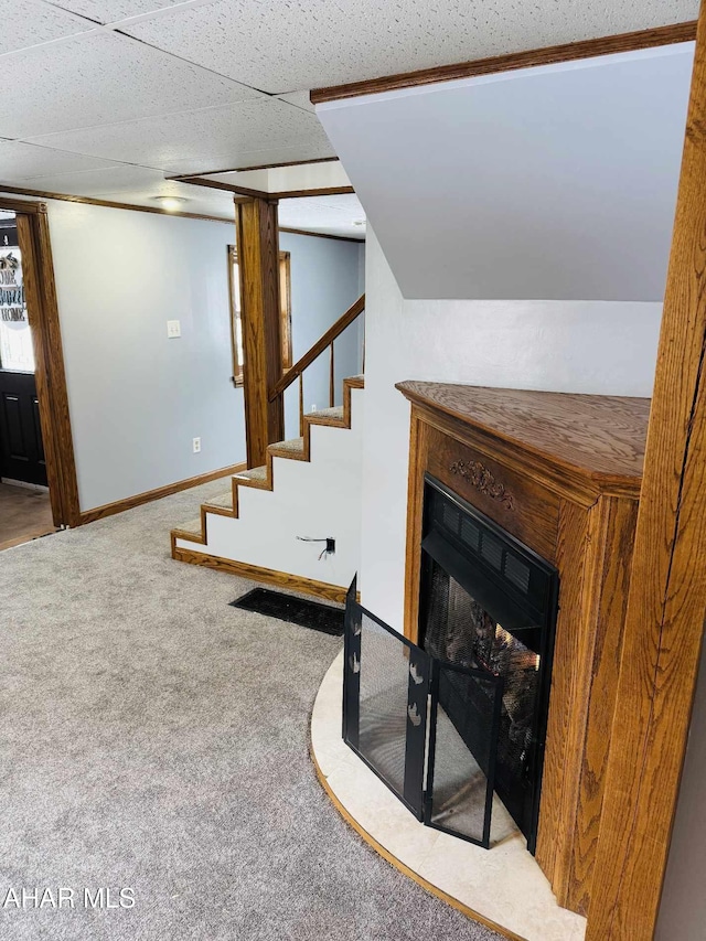 staircase featuring carpet flooring