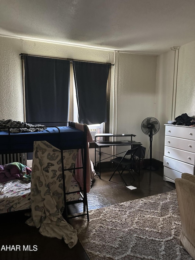 bedroom featuring dark wood-type flooring