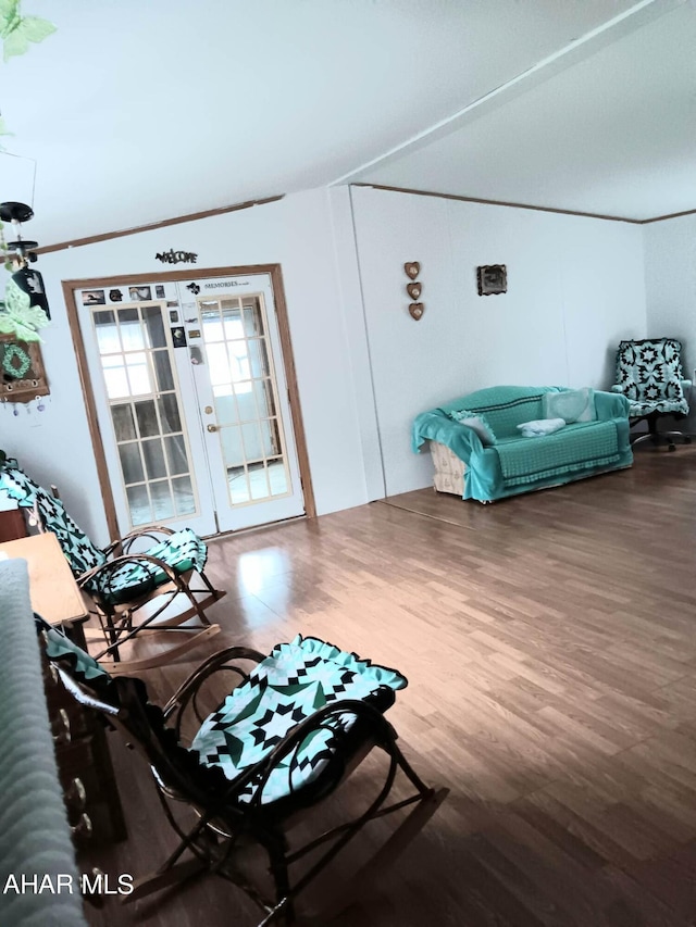 living room featuring french doors and hardwood / wood-style flooring