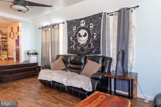 sitting room featuring ceiling fan and dark hardwood / wood-style floors