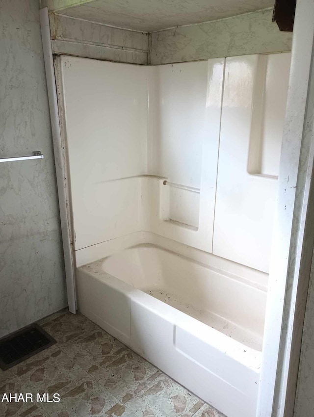 bathroom featuring a tub to relax in