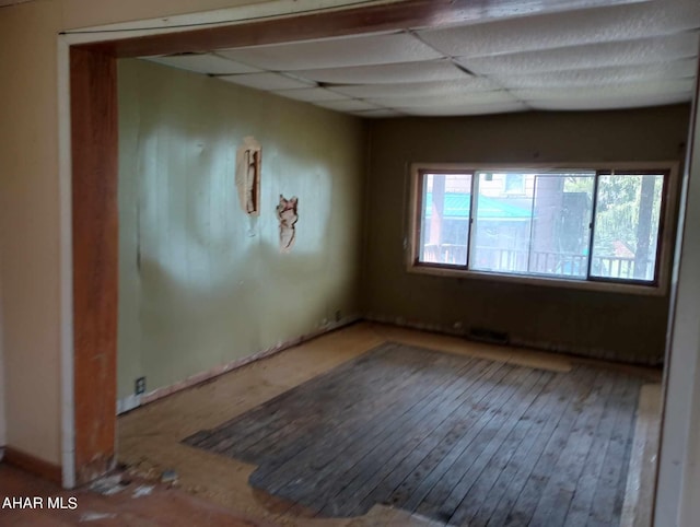 spare room featuring hardwood / wood-style flooring