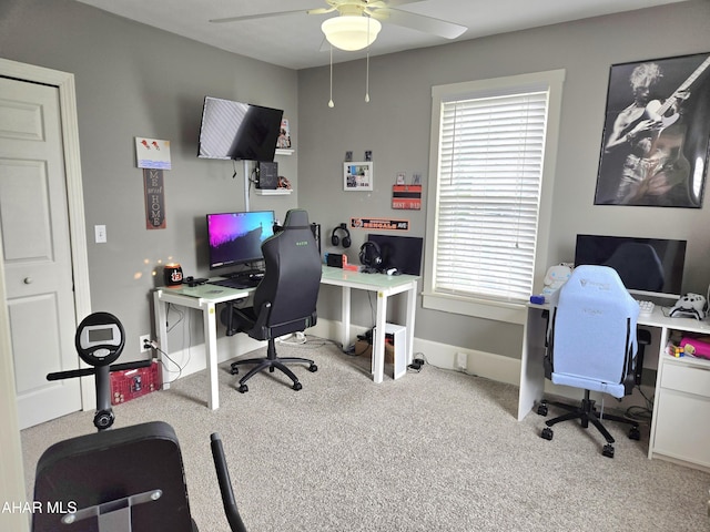 home office featuring ceiling fan and light carpet