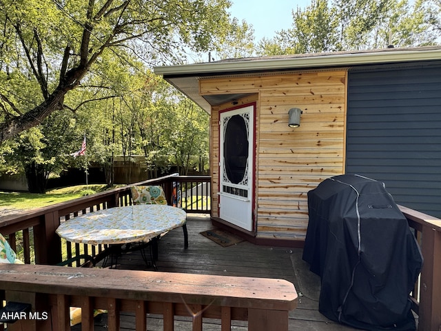 wooden deck with grilling area