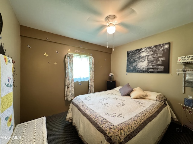 carpeted bedroom featuring ceiling fan